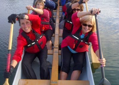 River Spirit paddlers in the boat wearing life jackets