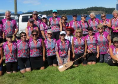 River Spirit team group photo in pink jerseys at Race the River