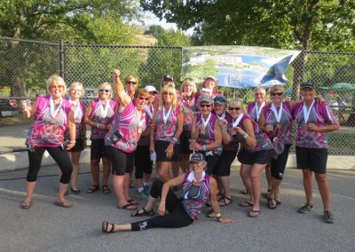 River Spirit paddlers celebrating with their medals at a regatta